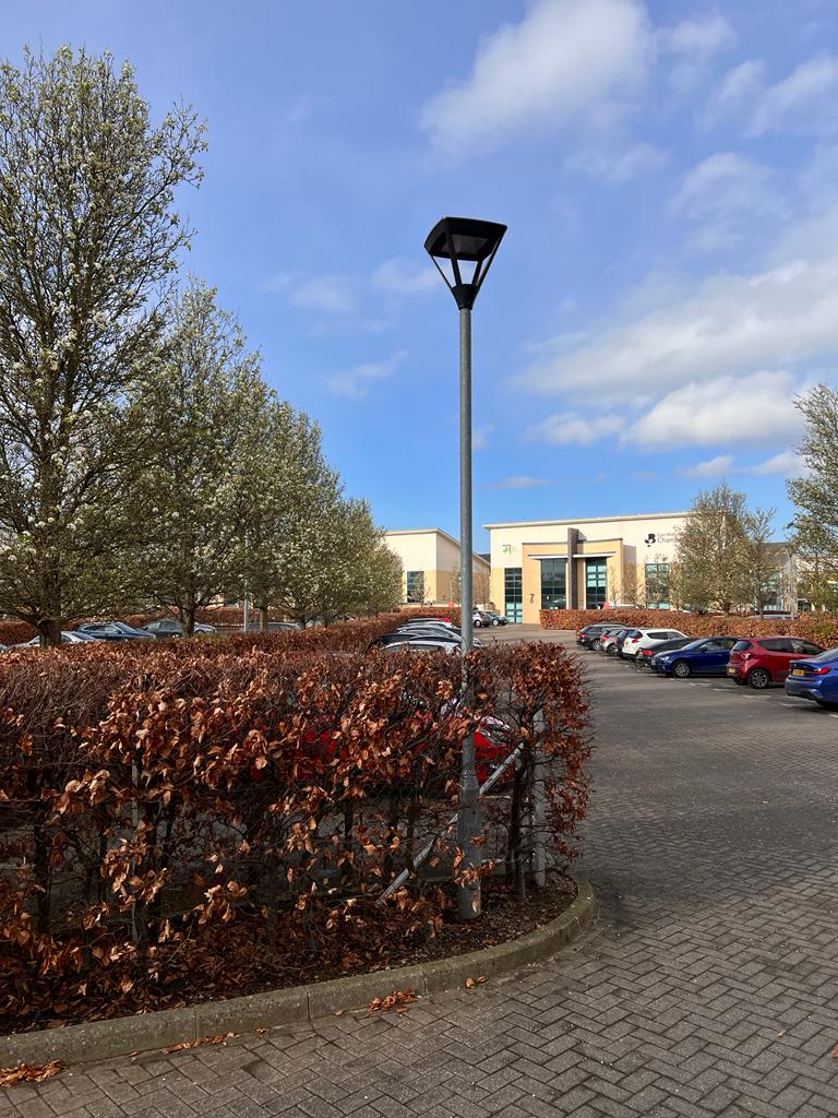 Agia LED post top light fixture installed in car park